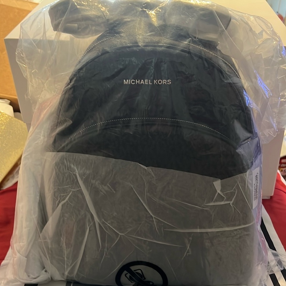 Large Brand new Abbey Backpack and matching wallet!